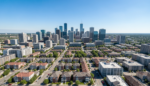Aerial view of a thriving city skyline with residential and commercial properties, representing real estate investment opportunities