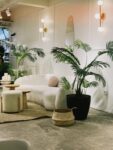 Beautifully designed sustainable living room with reclaimed wood furniture, natural textiles and indoor plants