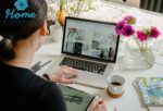 Person creating a digital mood board on laptop with interior design images and colour swatches