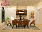 Professional interior designer pointing to consistent design elements across multiple room mood boards